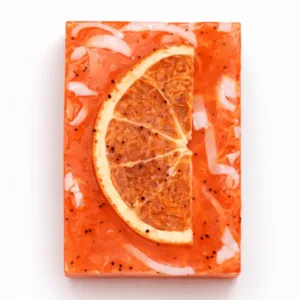 Handmade grapefruit soap with dried citrus slice on white background