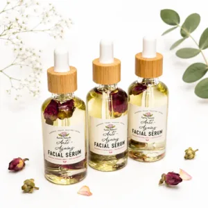 Karina Naturals daily rejuvenating facial oil with rosehip, argan and jojoba in a glass dropper bottle on a clean white background.