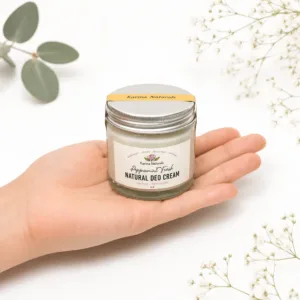 Karina Naturals handmade natural peppermint deodorant cream with botanicals in the background