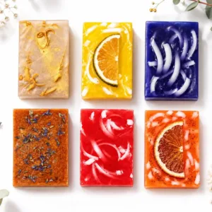 Handmade gift box soap collection by Karina Naturals with coconut, lemon mint, blueberry, cherry, lavender, and grapefruit soaps.