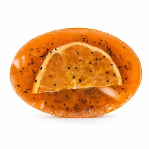 Handmade sweet orange massage soap with massage nodules and poppy seeds for exfoliation and relaxation