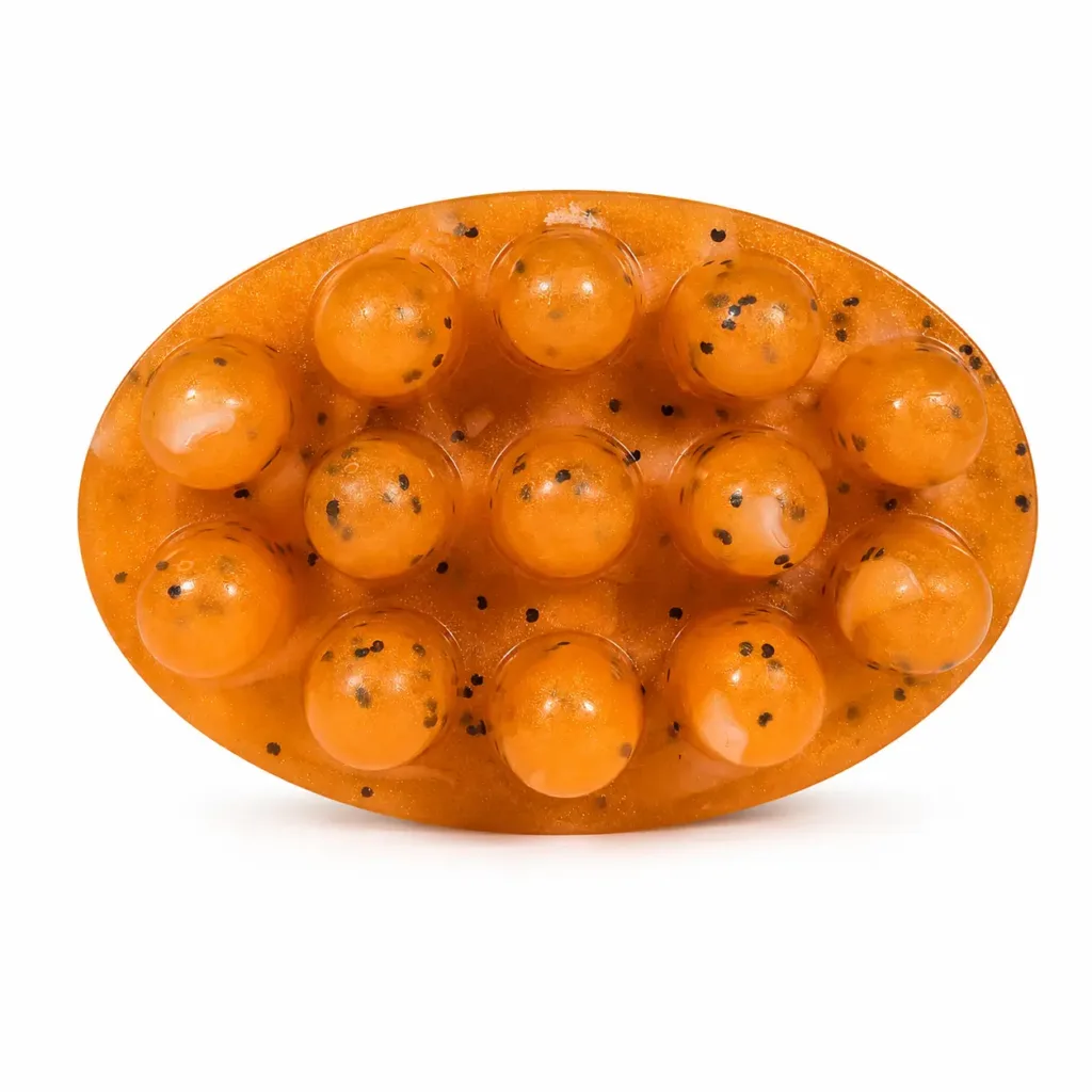 Handmade sweet orange massage soap with massage nodules and poppy seeds for exfoliation and relaxation